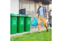 Man recycling household waste.